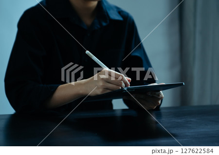 Businesswoman hand using laptop, tablet and smartphone in office. Digital marketing media mobile app and discussing plan new start up project. 127622584