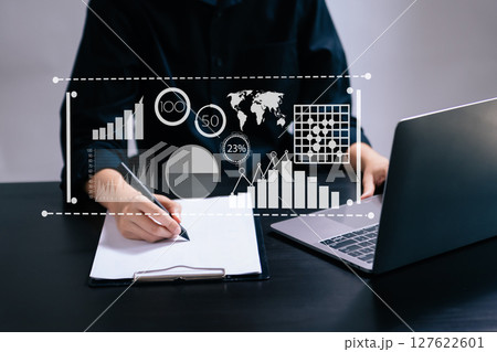 Team colleagues wear formal attire to work together to optimize business processes by using new technologies. high tech hologram Team colleagues wear formal attire to work together to optimize business processes by using new technologies. high tech hologram 127622601
