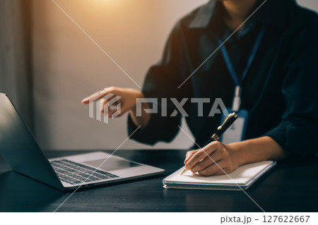 Businesswoman hand using laptop, tablet and smartphone in office. Digital marketing media mobile app and discussing plan new start up project. Businesswoman hand using laptop, tablet and smartphone in office. Digital marketing media mobile app and discussing plan new start up project. 127622667