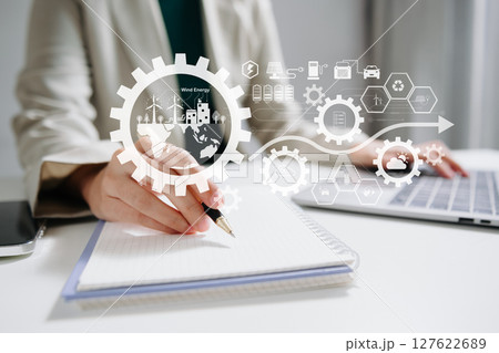 ESG concept of environmental, Green ethical business preserving resources, reducing CO2, Business person working on laptop virtual smartphone to reduce CO2 127622689