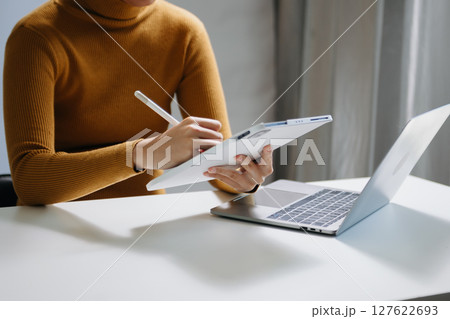 businesswoman hand working with new modern computer using on smartphone and tablet as concept businesswoman hand working with new modern computer using on smartphone and tablet as concept 127622693