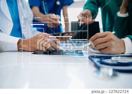 Project manager working and update tasks with Gantt chart scheduling diagram at hospital .success smart medical doctor working with smart medical doctor 127622724