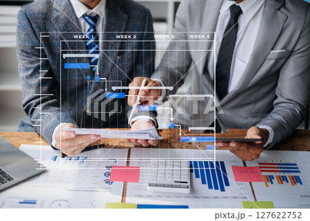 Project manager working and update tasks with milestones progress planning and Gantt chart scheduling diagram.business tram working at office Project manager working and update tasks with milestones progress planning and Gantt chart scheduling diagram.business tram working at office 127622752