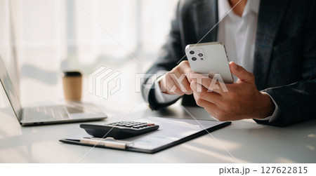 Man using on smartphone and tablet at home as concept Man using on smartphone and tablet at home as concept 127622815