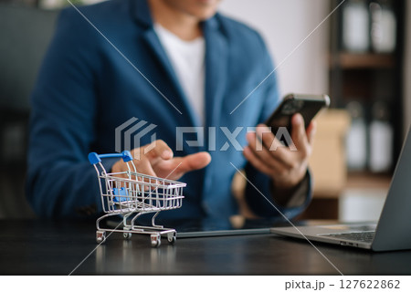 Cart Online Shopping concept. businesswoman hand using smart phone, tablet payments and holding credit card online shopping, omni channel, computer Cart Online Shopping concept. businesswoman hand using smart phone, tablet payments and holding credit card online shopping, omni channel, computer 127622862