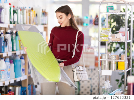 Woman choosing a folding board 127623321