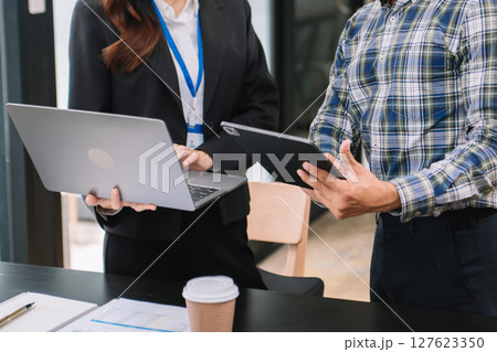 Business team meeting present.professional investor working with Finance managers task. with laptop smart phone and digital tablet Business team meeting present.professional investor working with Finance managers task. with laptop smart phone and digital tablet 127623350