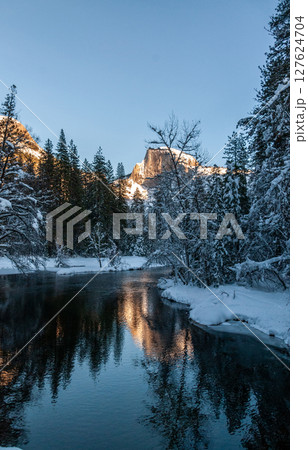 Sunset at Half dome reflected in the merced rivier 127624704