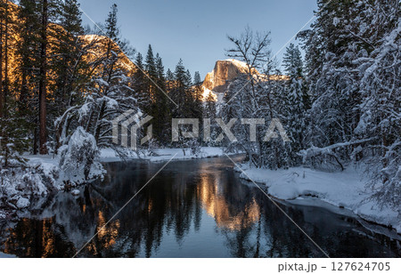 Sunset at Half dome reflected in the merced rivier 127624705