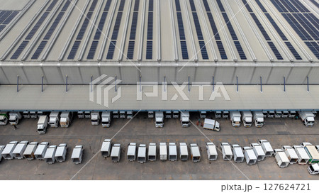 Aerial view semi truck cargo trailer at logistic park warehouse goods, Distribution warehouse shipping supply chain, Business transportation logistic freight shipping cargo by semi truck cargo trailer 127624721