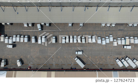 Aerial view semi truck cargo trailer at logistic park warehouse goods, Distribution warehouse shipping supply chain, Business transportation logistic freight shipping cargo by semi truck cargo trailer 127624723