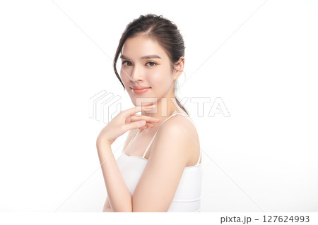 A beautiful young Asian woman with clean, fresh skin against a white background. Skincare, facial treatment, cosmetology, beauty, and spa. An elegant portrait of an Asian woman. A beautiful young Asian woman with clean, fresh skin against a white background. Skincare, facial treatment, cosmetology, beauty, and spa. An elegant portrait of an Asian woman. 127624993