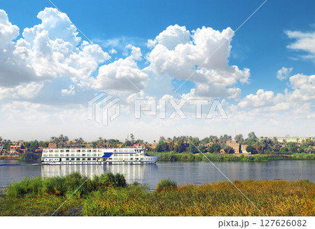 View from cruise ship on the Nile river, Egypt, Africa. Famous tourist attraction. Summer relaxing on cruise ships. Topic of travel, trip abroad on vacation, cruises and tours 127626082