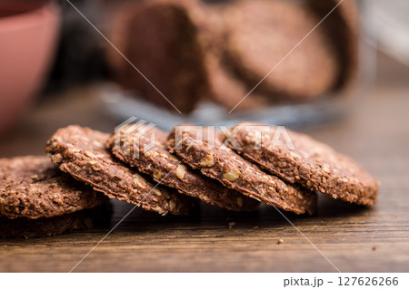 Sweet oatmeal cookies on wooden table. Sweet oatmeal cookies on wooden table. 127626266