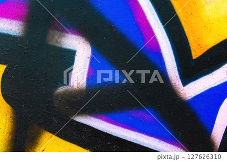 Abstract Graffiti Close-Up in Bold Yellow, Blue, Pink with 80s, Urban Vibe 127626310