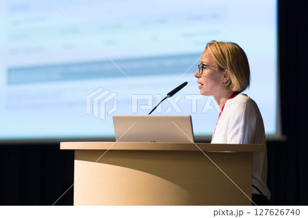 Female speaker giving a talk on corporate business conference. Business and Entrepreneurship event Female speaker giving a talk on corporate business conference. Business and Entrepreneurship event 127626740