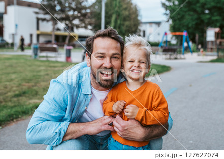 Portrait of dad and child enjoying time together Portrait of dad and child enjoying time together 127627074