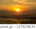 Golden Sunset Silhouette Over Sea with Waves and Cloudy Sky, Sumatra Beach, Lampung 127628634
