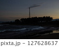 Silhouette of Telecommunication Tower and Coconut Tree on the Beach at Dusk 127628637
