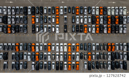 Aerial view vehicle stockyard with new cars pickup truck parked in row, Automotive industry logistic and distribution, New cars for import export tansportation logistic, New cars line up. Aerial view vehicle stockyard with new cars pickup truck parked in row, Automotive industry logistic and distribution, New cars for import export tansportation logistic, New cars line up. 127628742