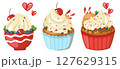 Cupcakes with whipped cream and red cherry. Portion sized, beautifully served dessert. Muffin with cream. 127629315