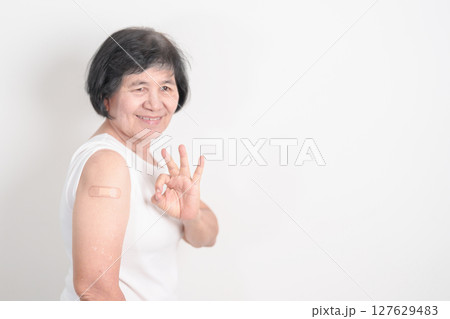 Elderly Woman with bandage after received vaccine. Vaccination and Immunization for Influenza, Herpes Zoster, Tetanus, Covid 19 booster, Dengue, Encephalitis, Rabies, Pneumococcal, IPD, RSV Vaccines Elderly Woman with bandage after received vaccine. Vaccination and Immunization for Influenza, Herpes Zoster, Tetanus, Covid 19 booster, Dengue, Encephalitis, Rabies, Pneumococcal, IPD, RSV Vaccines 127629483