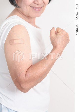 Elderly Woman with bandage after received vaccine. Vaccination and Immunization for Influenza, Herpes Zoster, Tetanus, Covid 19 booster, Dengue, Encephalitis, Rabies, Pneumococcal, IPD, RSV Vaccines Elderly Woman with bandage after received vaccine. Vaccination and Immunization for Influenza, Herpes Zoster, Tetanus, Covid 19 booster, Dengue, Encephalitis, Rabies, Pneumococcal, IPD, RSV Vaccines 127629493