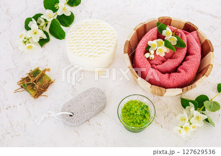 Spa products for facial and body care with soft terry towel. Spa products for facial and body care with soft terry towel. 127629536