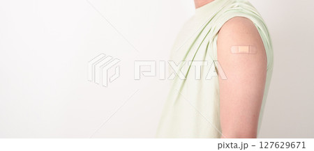 Adult Man with bandage after received vaccine. Vaccination and Immunization for Influenza, HPV, Zoster, IPD, DTP or Diphtheria, Tetanus and Pertussis, MMR, Hepatitis B, Covid and Varicella vaccine Adult Man with bandage after received vaccine. Vaccination and Immunization for Influenza, HPV, Zoster, IPD, DTP or Diphtheria, Tetanus and Pertussis, MMR, Hepatitis B, Covid and Varicella vaccine 127629671
