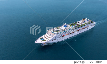 Aerial view luxury ocean cruise ship on clam blue sea, Elegant modern travel lifestyle, Luxury cruise ship liner modern maritime business ocean tourism, Global business cruise ship liner industry. 127630046
