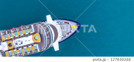 Aerial view luxury ocean cruise ship on clam blue sea, Elegant modern travel lifestyle, Luxury cruise ship liner modern maritime business ocean tourism, Global business cruise ship liner industry. Aerial view luxury ocean cruise ship on clam blue sea, Elegant modern travel lifestyle, Luxury cruise ship liner modern maritime business ocean tourism, Global business cruise ship liner industry. 127630288