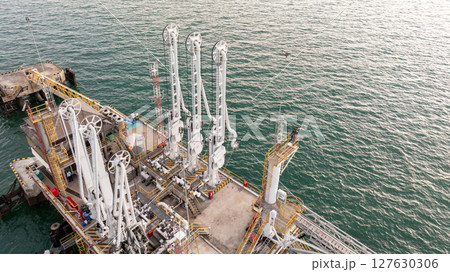 Aerial view industrial offshore oil gas terminal tanker ship, Global energy supply chain marine logistic transportation infrastructure, Oil gas industrial terminal tanker ship energy logistic industry Aerial view industrial offshore oil gas terminal tanker ship, Global energy supply chain marine logistic transportation infrastructure, Oil gas industrial terminal tanker ship energy logistic industry 127630306