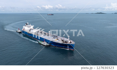 Aerial view LPG gas tanker ship on deep blue sea, Global business freight shipping import export logistic transportation oil and gas product tanker ship, Liquefied Petroleum Gas LPG tanker ship in sea Aerial view LPG gas tanker ship on deep blue sea, Global business freight shipping import export logistic transportation oil and gas product tanker ship, Liquefied Petroleum Gas LPG tanker ship in sea 127630323