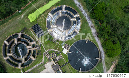 Aerial view westewater treatment tank with wastewater, Circle circular water clarifier cleaning water, Circle water treatment plant circular clarifier, Water treatment plant. Aerial view westewater treatment tank with wastewater, Circle circular water clarifier cleaning water, Circle water treatment plant circular clarifier, Water treatment plant. 127630467