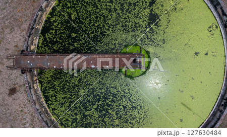 Aerial view westewater treatment tank with wastewater, Circle circular water clarifier cleaning water, Circle water treatment plant circular clarifier, Water treatment plant. Aerial view westewater treatment tank with wastewater, Circle circular water clarifier cleaning water, Circle water treatment plant circular clarifier, Water treatment plant. 127630484