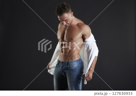male model - fitness addicted shot in studio background male model - fitness addicted shot in studio background 127630933