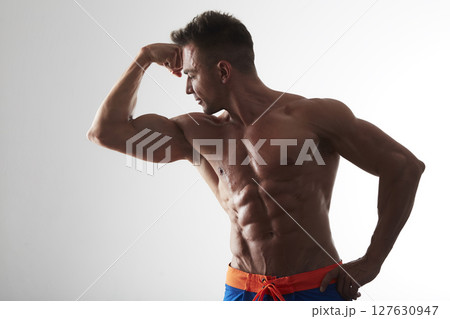 male model - fitness addicted shot in studio background male model - fitness addicted shot in studio background 127630947