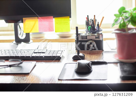 Workplace of a freelance graphic designer at a computer Workplace of a freelance graphic designer at a computer 127631209