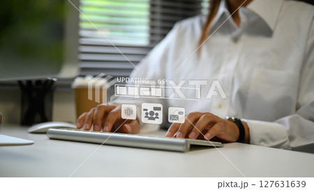 Businesswoman managing software update, symbolizing productivity and digital workflow Businesswoman managing software update, symbolizing productivity and digital workflow 127631639