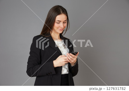 young female doctor in studio background young female doctor in studio background 127631782