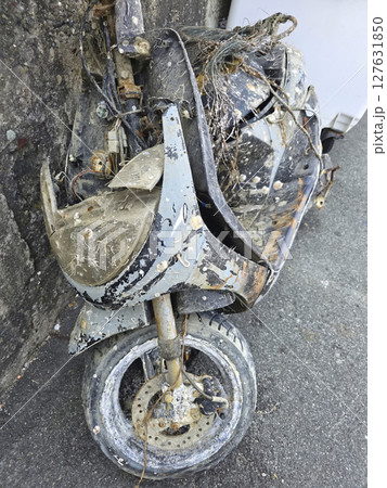Rusted encrusted motorbike recovered from the underwater sea 127631850