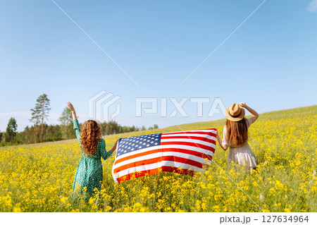 4th of July. Independence Day. Patriotic holiday. USA flag fluttering in the wind. 4th of July. Independence Day. Patriotic holiday. USA flag fluttering in the wind. 127634964