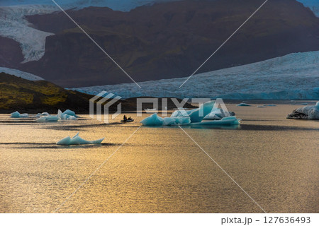 Glacier and icebergs in Fjallsarlon Glacial Lagoon, Iceland. Great tourist attraction 127636493