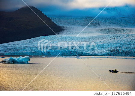 Glacier and icebergs in Fjallsarlon Glacial Lagoon, Iceland. Great tourist attraction Glacier and icebergs in Fjallsarlon Glacial Lagoon, Iceland. Great tourist attraction 127636494