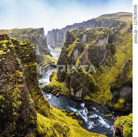 Unique landscape of Fjadrargljufur in Iceland. Top tourism destination. Fjadrargljufur Canyon is a massive canyon about 100 meters deep, located in South East of Iceland. Unique landscape of Fjadrargljufur in Iceland. Top tourism destination. Fjadrargljufur Canyon is a massive canyon about 100 meters deep, located in South East of Iceland. 127636506
