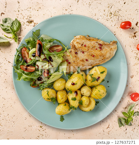 Grilled chicken breast with roasted potatoes Grilled chicken breast with roasted potatoes 127637271