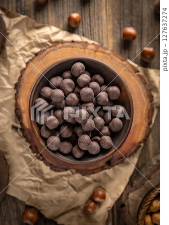 Chocolate covered hazelnuts Chocolate covered hazelnuts 127637274