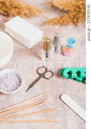 Set of items for manicure and pedicure on the table vertical view Set of items for manicure and pedicure on the table vertical view 127638540