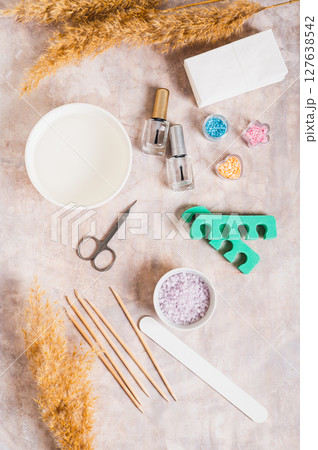 Set of items for manicure and pedicure on the table top and vertical view Set of items for manicure and pedicure on the table top and vertical view 127638542