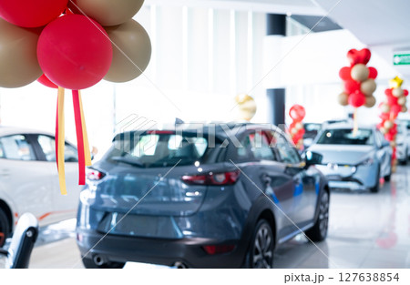 Car parked in luxury showroom. Car dealership office. Car showroom business. New car parked in modern showroom. Auto for sale and rent business. Automobile leasing and insurance. Electric automobile. 127638854